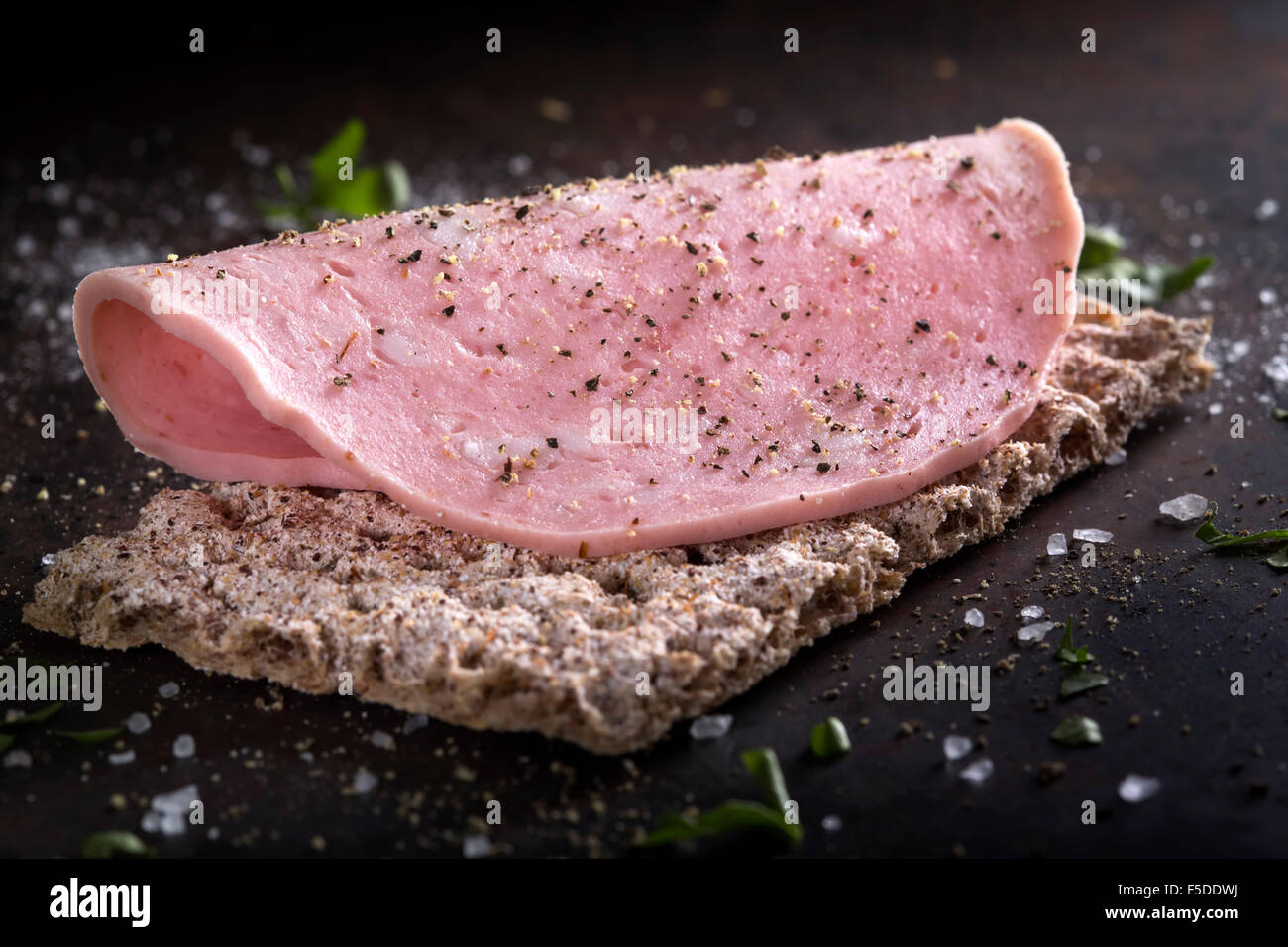 Close-up of appetizer with mortadella with pepper and salt Stock Photo