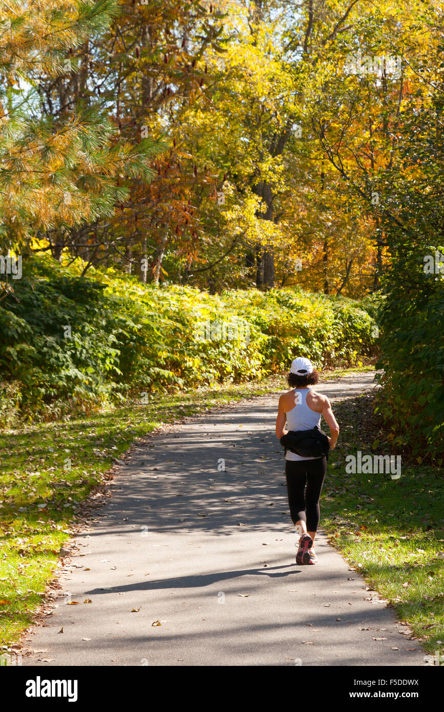 A jogger jogging on Stowe Recreation Path, Stowe, Vermont VT USA Stock Photo