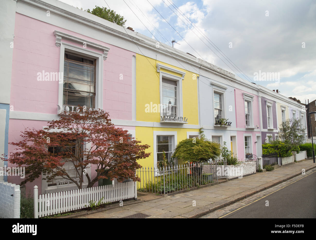 Colourfully painted terraced houses on Leverton Street, Kentish Town