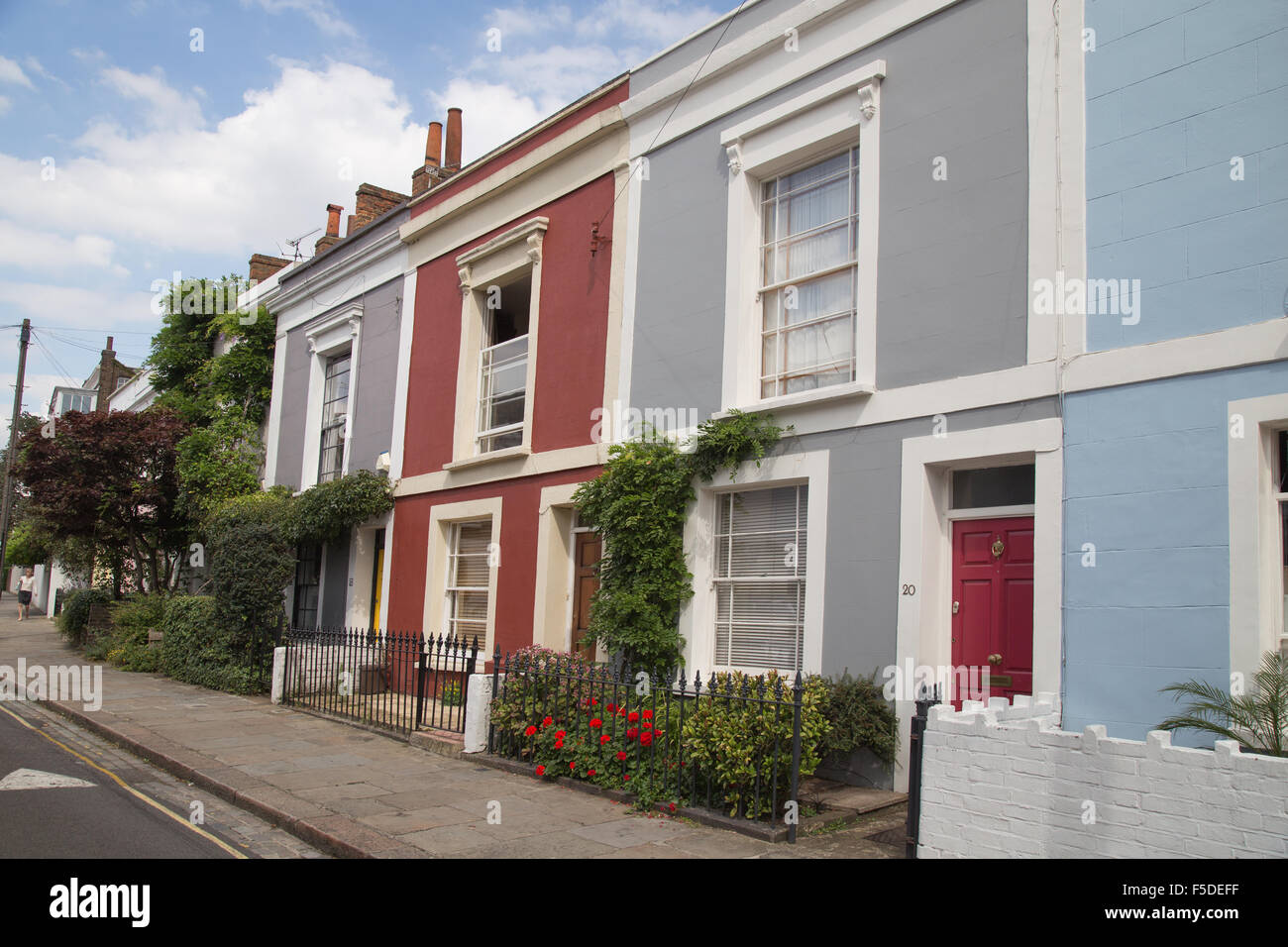 Colourfully painted terraced houses on Leverton Street, Kentish Town, London NW5, England, UK Stock Photo