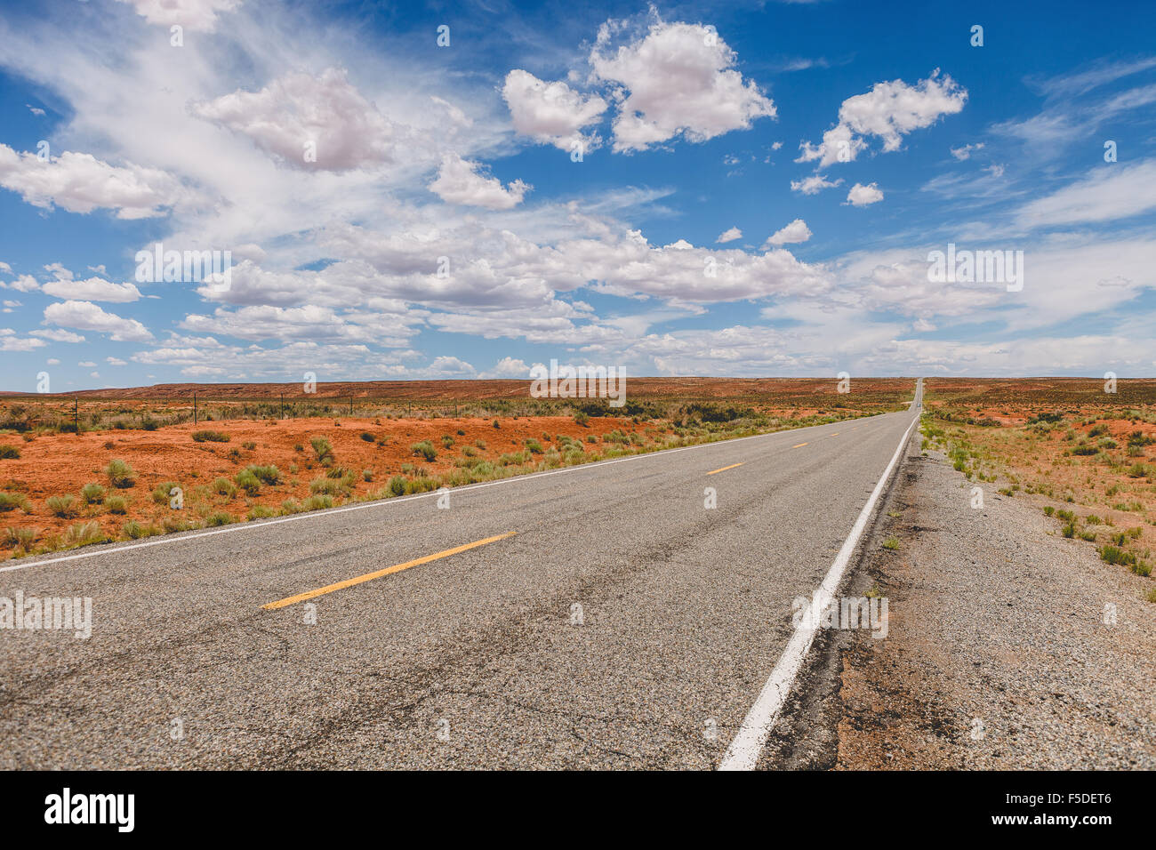 The road near Monument Valley Navajo Tribal Park, Utah (near the Utah/Arizona border), United States of America. Stock Photo