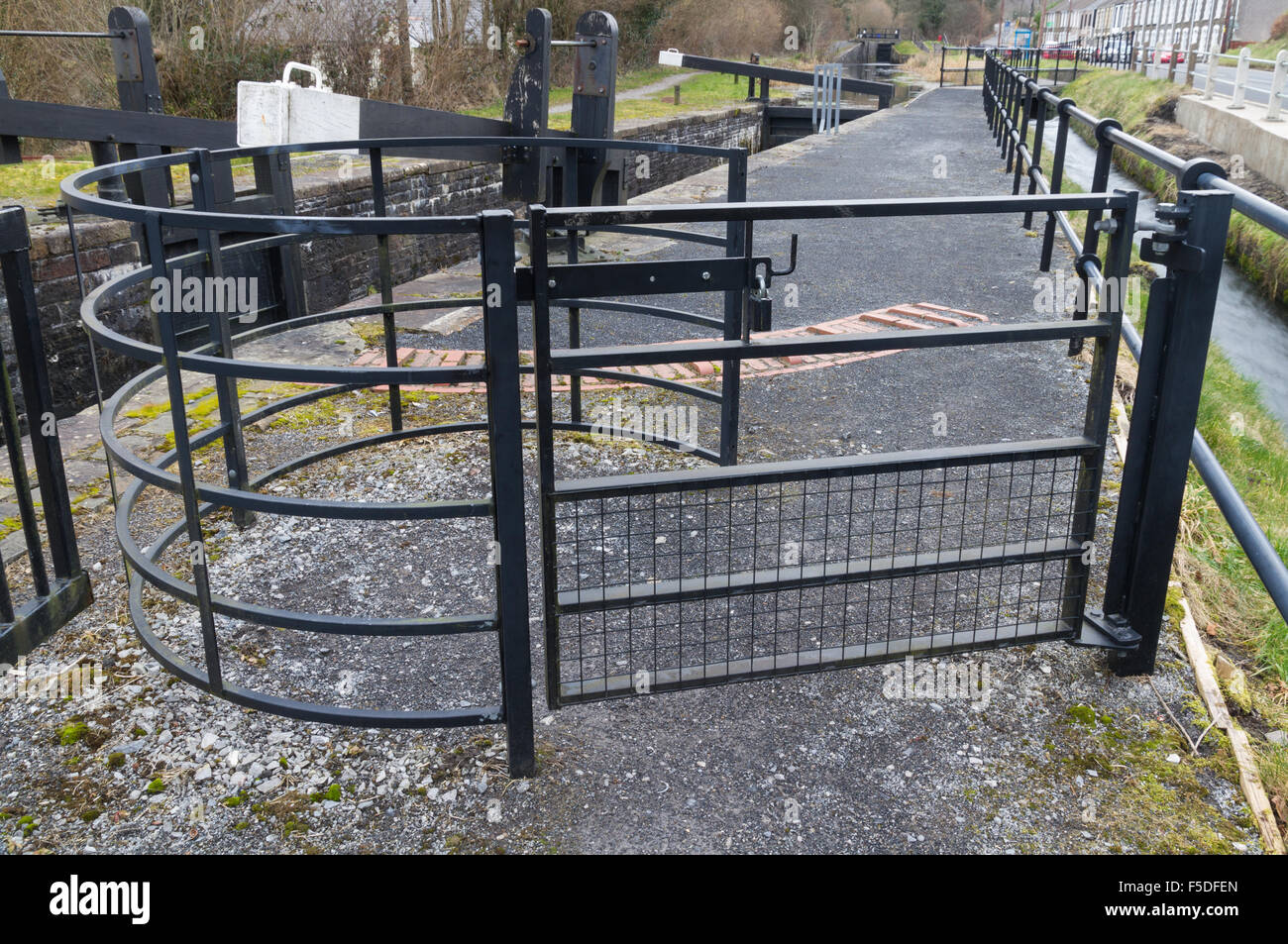 Gate used in the United Kingdom to allow people but not livestock to pass. By canal lock. Stock Photo