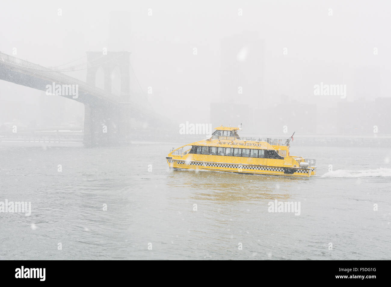 New York Water taxi ferry on East River during snowstorm. New York City