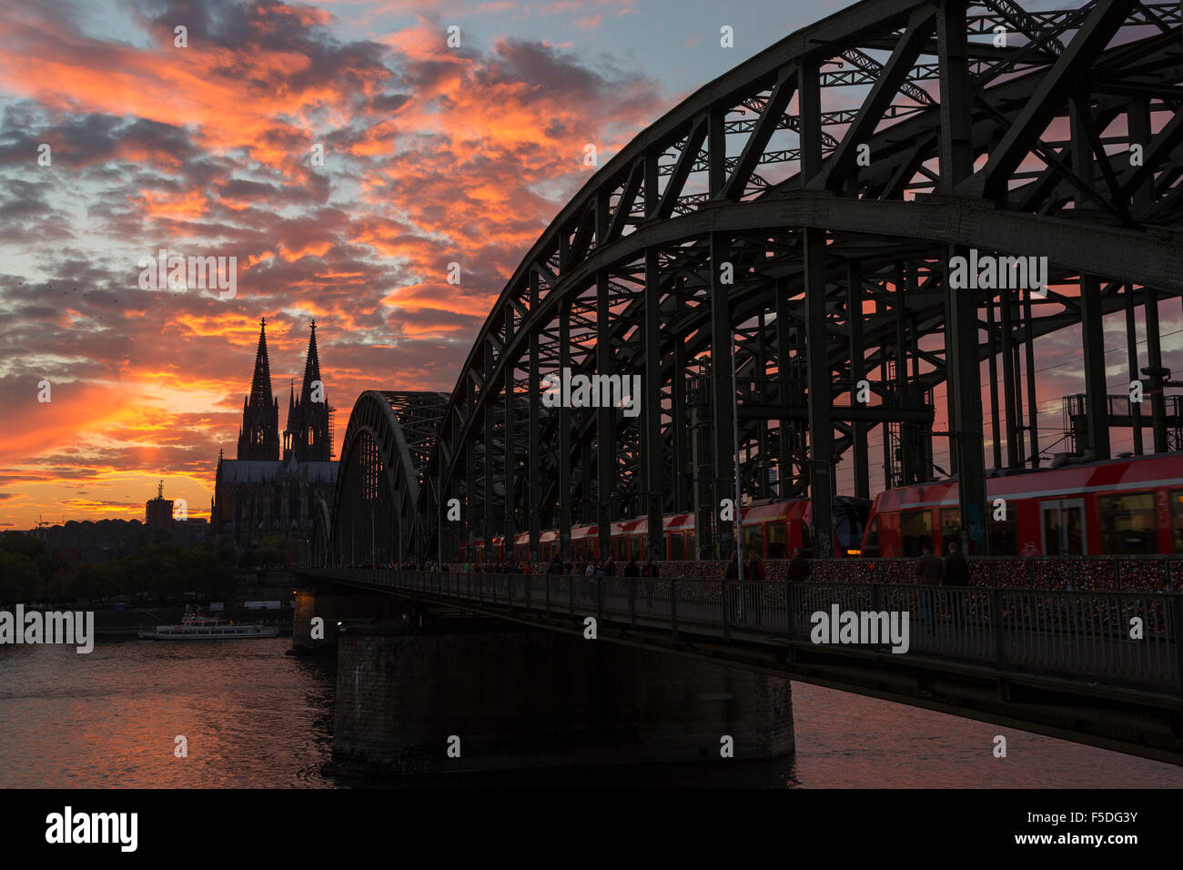 Kölner Dom, Cologne Cathedral and Hohenzollernbrücke bridge over the Rhine at sunset, Köln, Cologne, Germany Stock Photo
