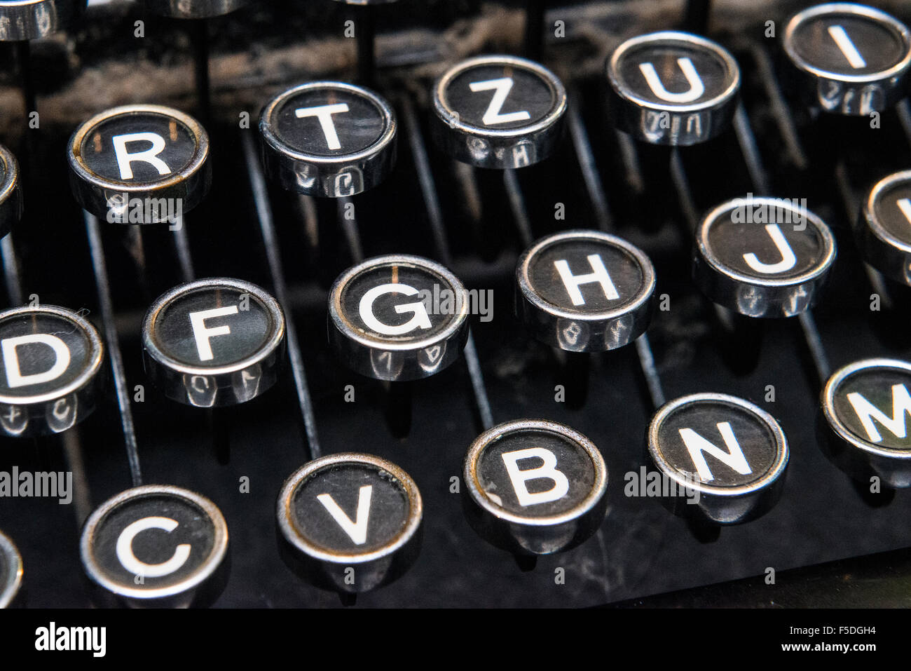 Keyboard on a vintage typewriter, Antique typewriter key, Typebar of a typewriter Stock Photo