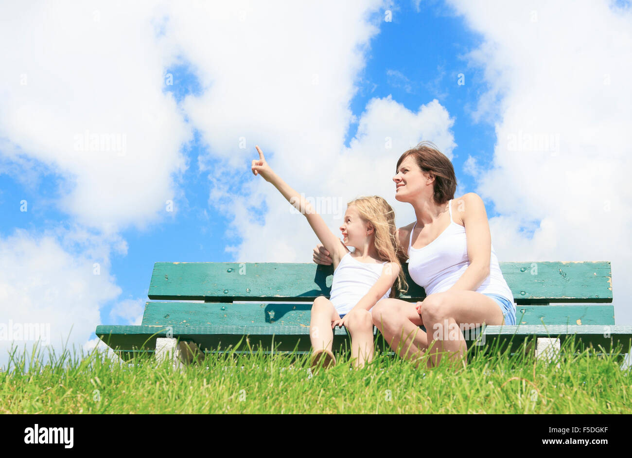 A woman with his child sitting on the bench Stock Photo