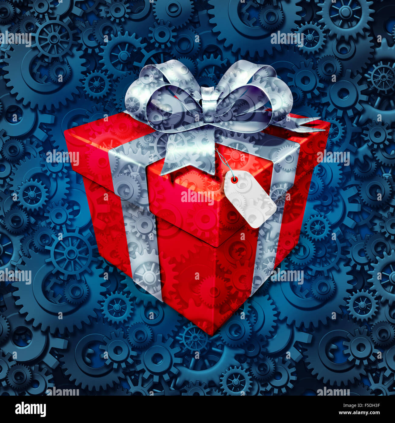 Gift business concept and corporate christmas or holiday presents symbol as a surpise box with a bow for a client or employee on a background of gears and cog wheels as a metaphor for the industry of giving. Stock Photo