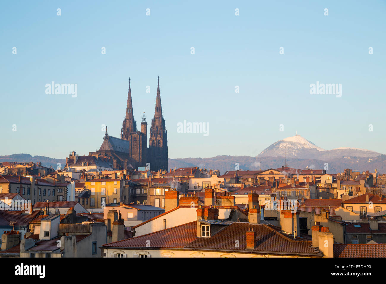 Roof top view of city center and volcano Puy de dome in Clermont ferrand, Auvergne, France Stock Photo