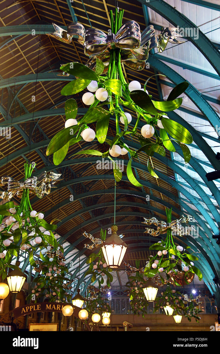 London, UK. 2nd November 2015. First sight of the new Covent Garden Mistletoe Christmas Decorations in London as they are installed in the market. The hanging boughs of mistletoe make a nice change to the giant Xmas tree baubles which have graced the halls of the market for the last couple of years. Credit:  Paul Brown/Alamy Live News Stock Photo