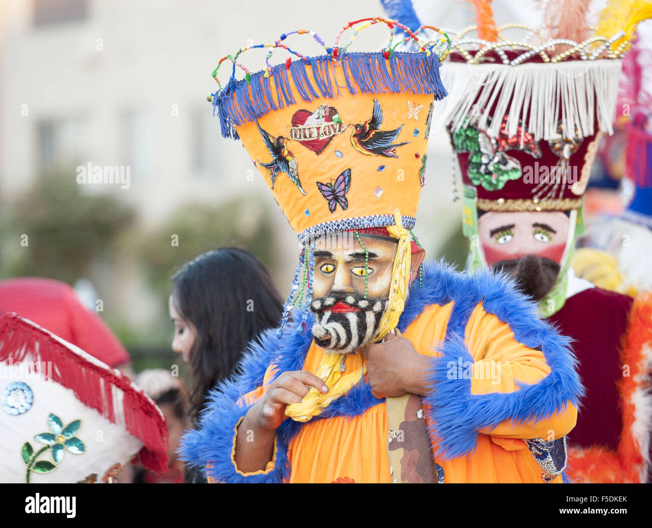 Huntington Beach, California, USA. 24th July, 2015. A Chinelo adjusts his  costume before beginning a performance. --- Residents from the Oak View  Neighborhood celebrated on Friday evening with Traditional Mexican Chinelo  Dancers.