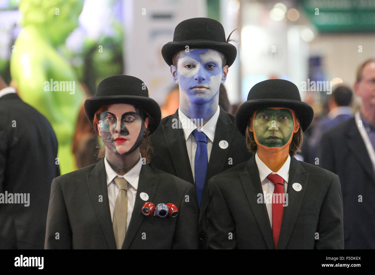 London, UK. 2nd Nov,  2015. Face painted exhibitors from The Belgium Tourist Office pose for photos at the World Travel Market 2015. Credit:  david mbiyu/Alamy Live News Stock Photo