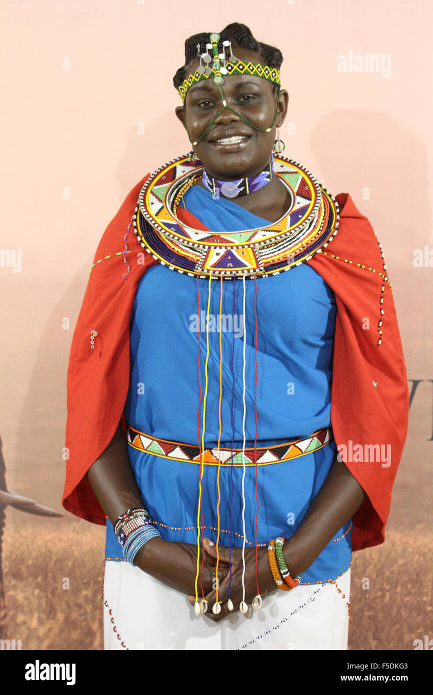 London, UK. 2nd Nov,  2015. Exhibitor dressed in Massai cultural custume from the Bomas of Kenya in cultural custom pose for photos at the Magical Kenya stand at the World Travel Market 2015. Credit:  david mbiyu/Alamy Live News Stock Photo