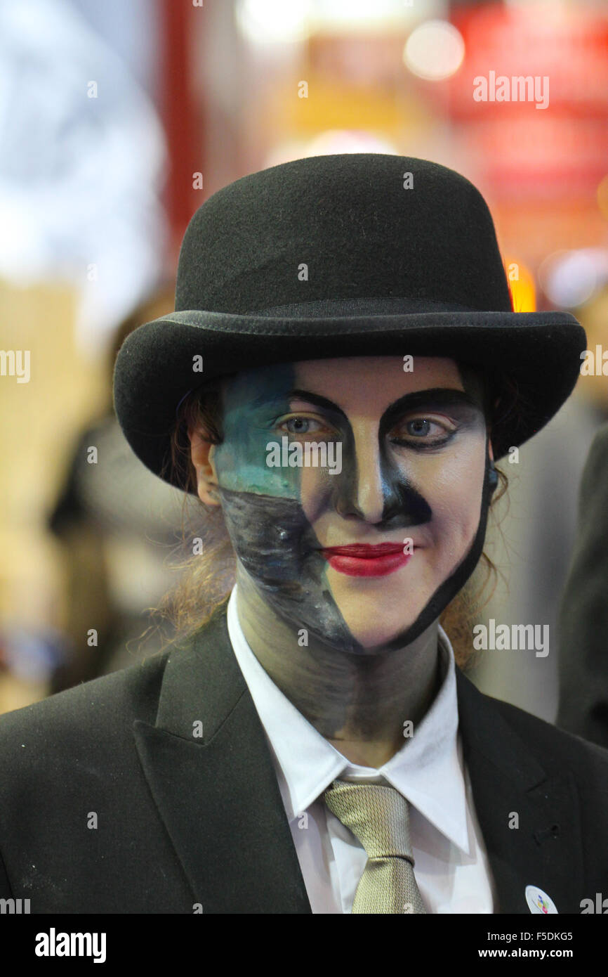 London, UK. 2nd Nov,  2015. Face painted exhibitors from The Belgium Tourist Office pose for photos at the  World Travel Market 2015. Credit:  david mbiyu/Alamy Live News Stock Photo