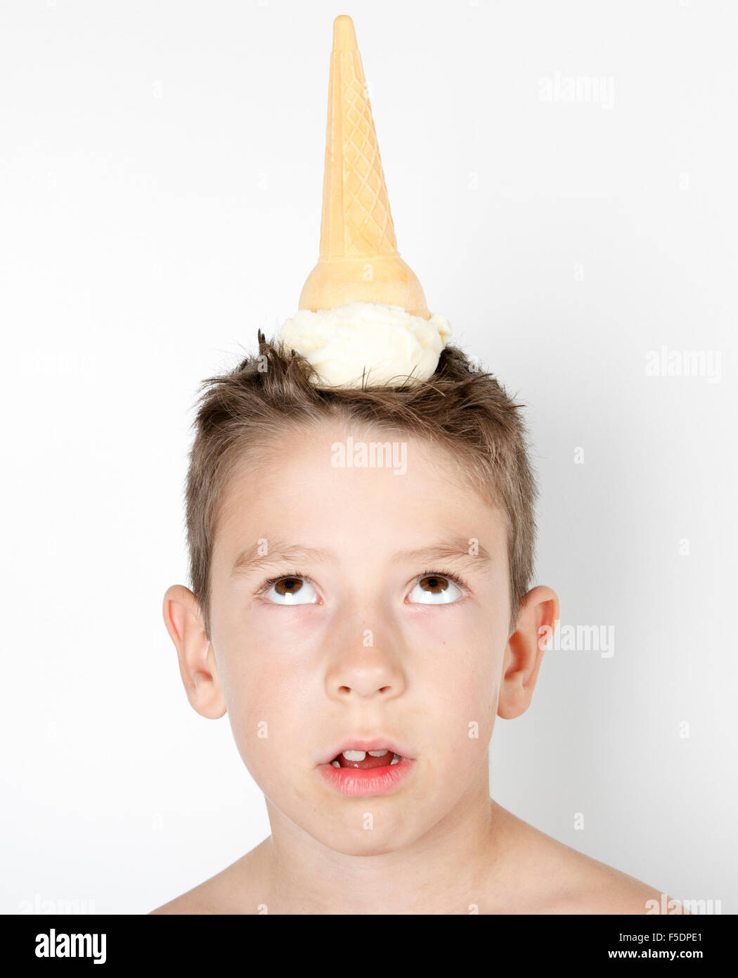 kid with ice cream on the head isolated on white Stock Photo Alamy
