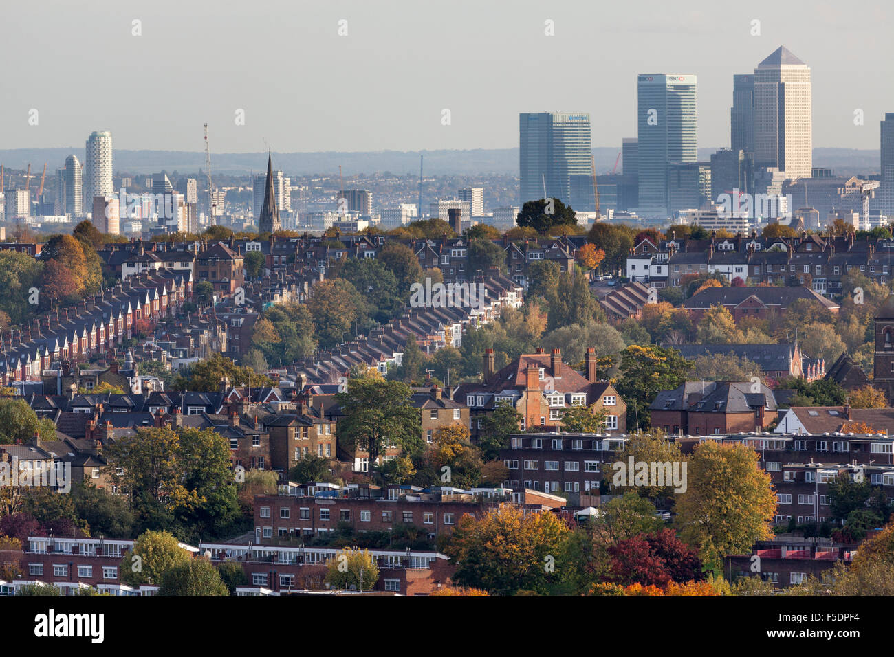 View over the London districts of Hornsey and Crouch End towards the tall buildings of Bow,Poplar and Canary Wharf, Docklands. Stock Photo