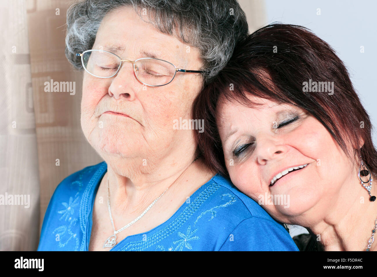 A senior grandmother with is daughter having great time in room Stock Photo