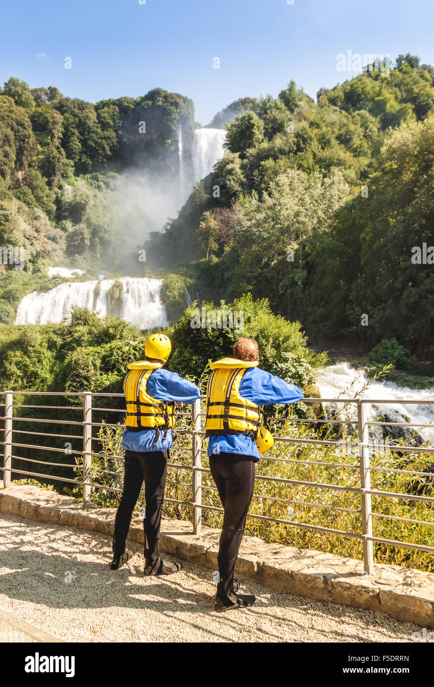 Two man with water equipment are waiting to canyoning Marmore's waterfall in italy Stock Photo