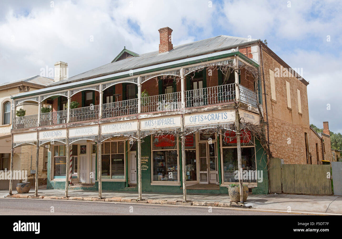 Historic building, old red brick double story shops with verandah & wrought iron in South Australian country town of Quorn Stock Photo