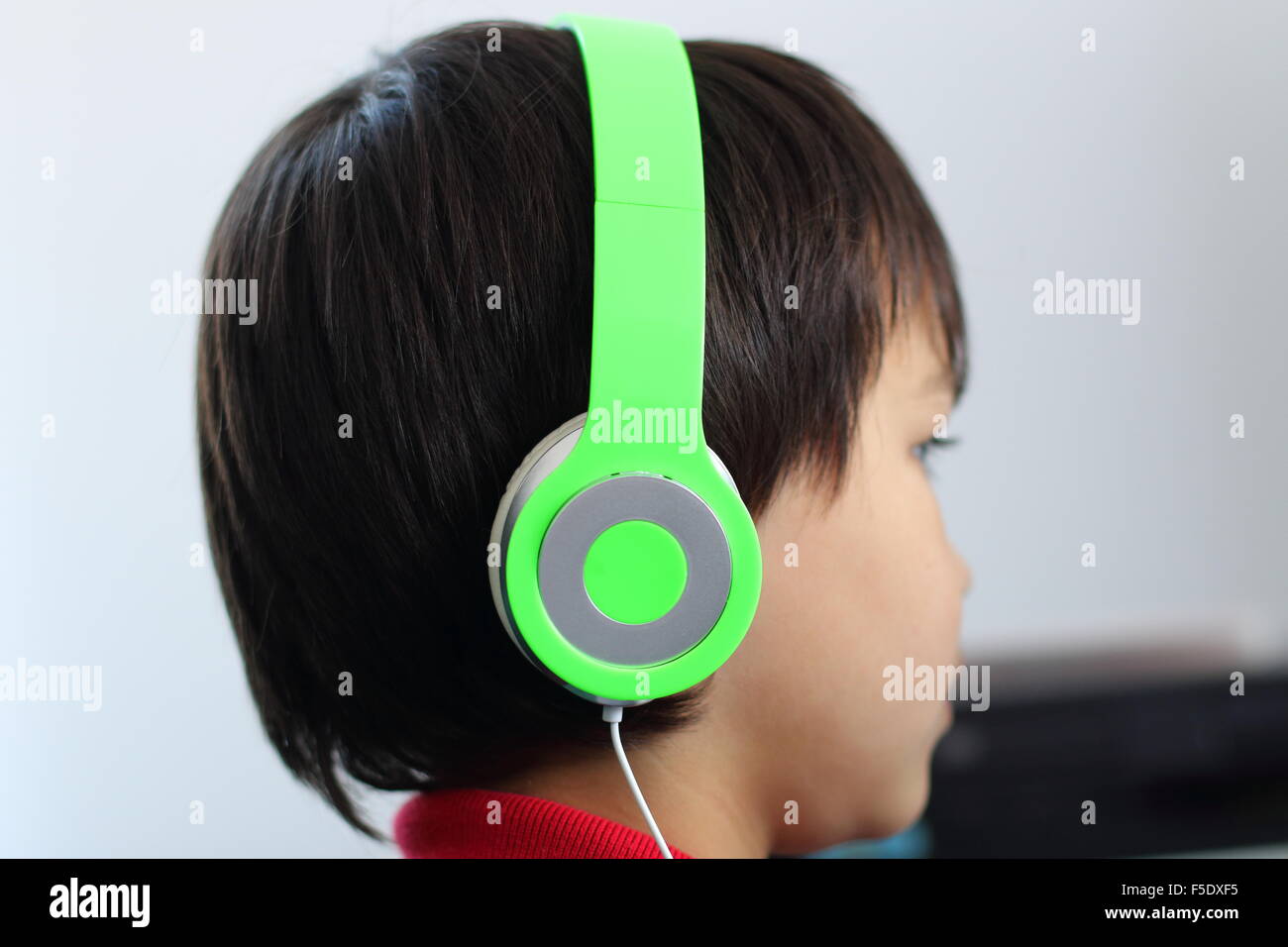 Young boy wearing a headphone Stock Photo - Alamy