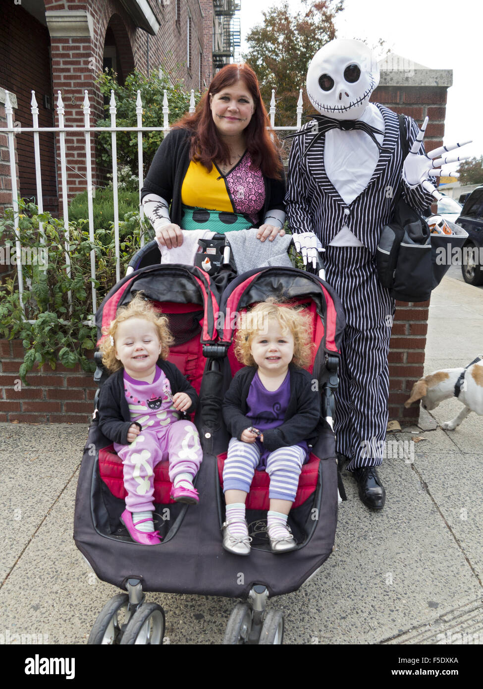 Family trickortreating n the Kensington section of Brooklyn, New York