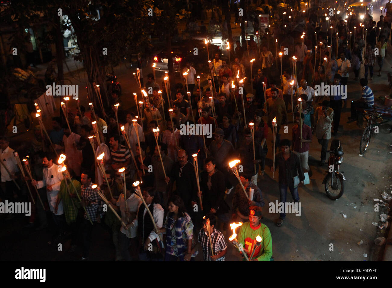Dhaka, Bangladesh. 2nd Nov, 2015. DHAKA, BANGLADESH 02nd November : Cultural activists, writers and members of the Ganajagaran Mancha shout slogans as they attend a torch light procession protesting the killing and attacks on the publisher and bloggers in Dhaka on November 02, 2015.Ganajagaran Mancha has called for a half-day country-wide strike on 03 November demanding the arrest of the assailants of publishers. The publisher Faisal Arefin Dipan was stabbed to death in Dhaka on 31 October, hours after unidentified assailants knifed another publisher and two secular bloggers elsewhere in th Stock Photo