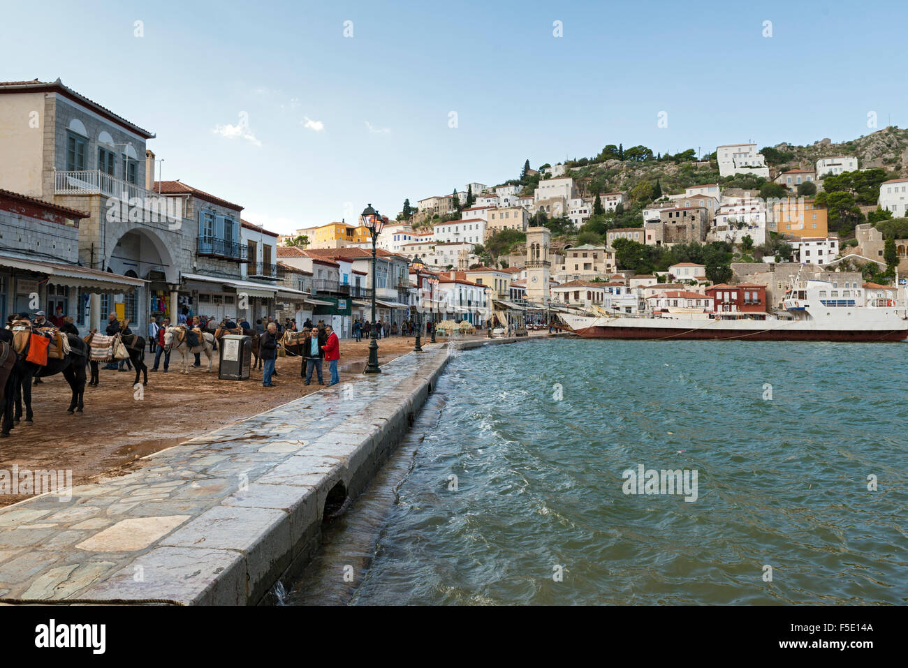 HYDRA, GREECE - OCTOBER 25, 2015: People in the harbor of the city of Hydra, Greece Stock Photo