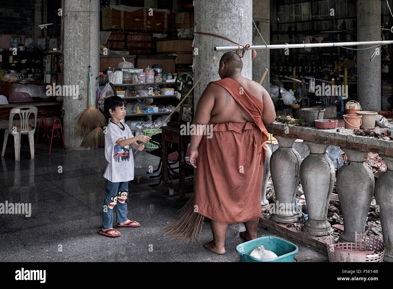 Obese child and friend. Thailand monk, Southeast Asia Stock Photo