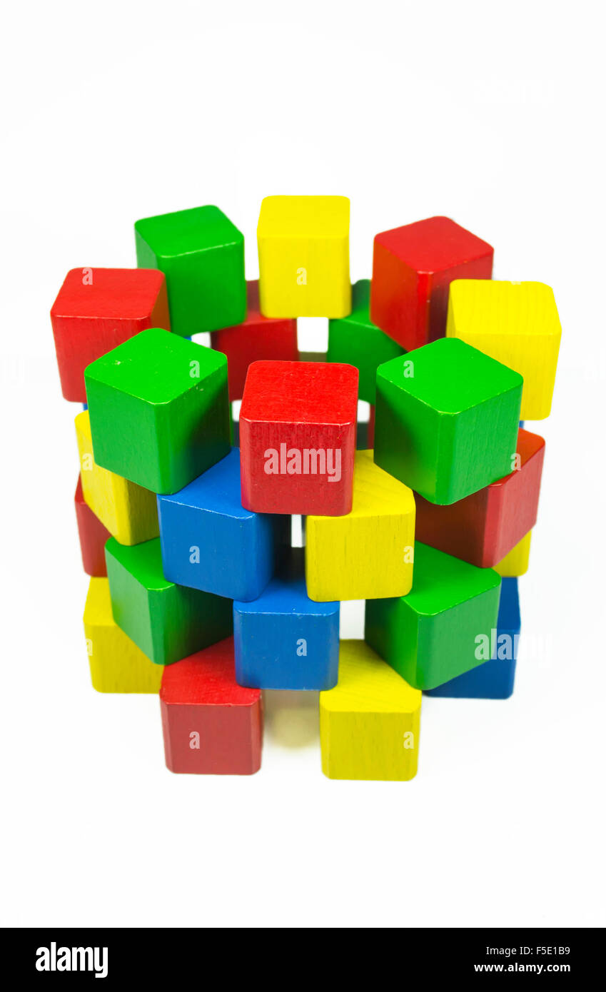 Well constructed from radial overlapping colored wooden cubes obtaining a three dimensional cylindrical shape Stock Photo