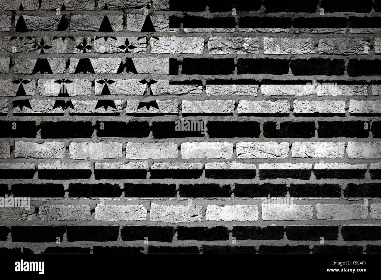 Dark brick wall texture - flag painted on wall - Brittany Stock Photo ...