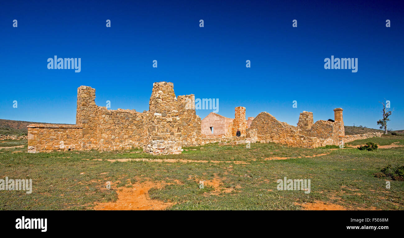 Panoramic view of heritage listed stone buildings at ruins of Kanyaka homestead under blue sky near Quorn, outback South Australia Stock Photo