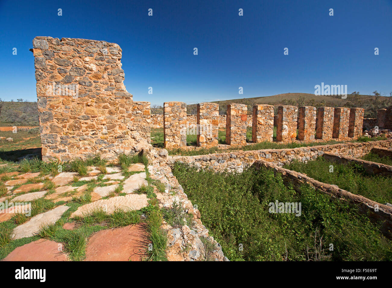 Skilful stonework walls & paving, remains of historic shearing shed at ruins of Kanyaka north of Quorn, outback South Australia Stock Photo