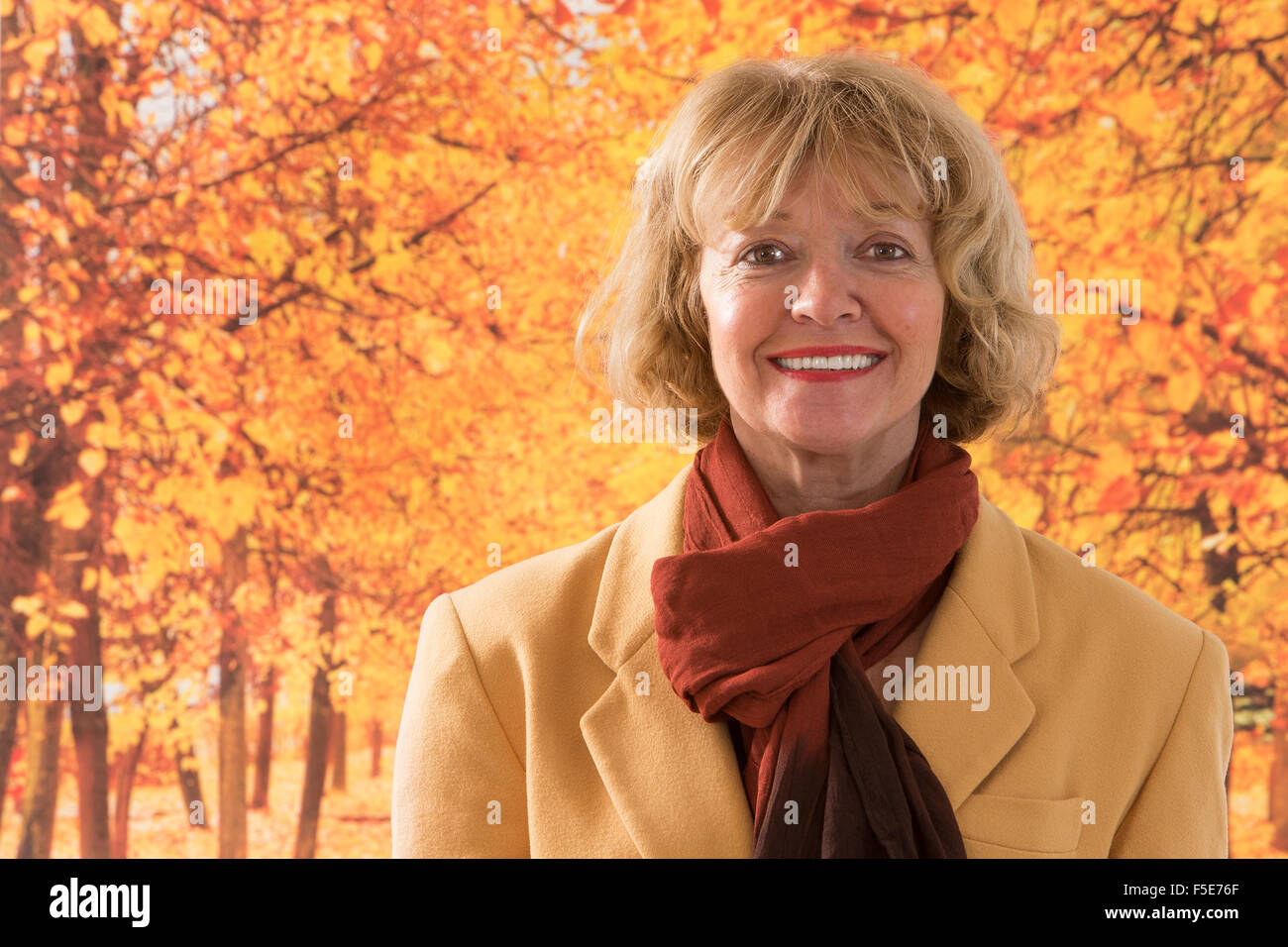 Portrait of beautiful aged woman in the park Stock Photo