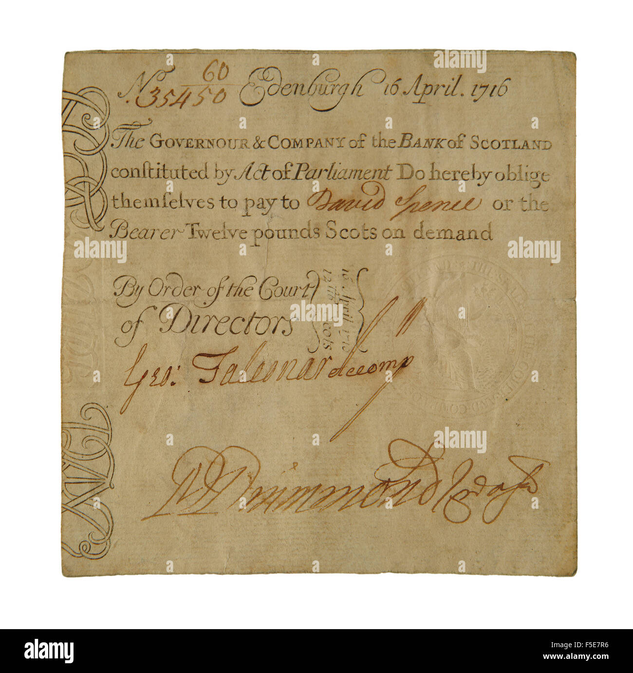 Old 12 'pound scots' banknote issued in April 1716 by Bank of Scotland. 12 'pounds scots' was equal to one pound sterling. Stock Photo