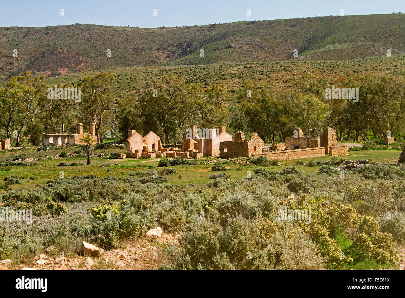 Landscape with historic stone buildings at ruins of Kanyaka homestead at foot of hill north of Quorn, in outback South Australia Stock Photo