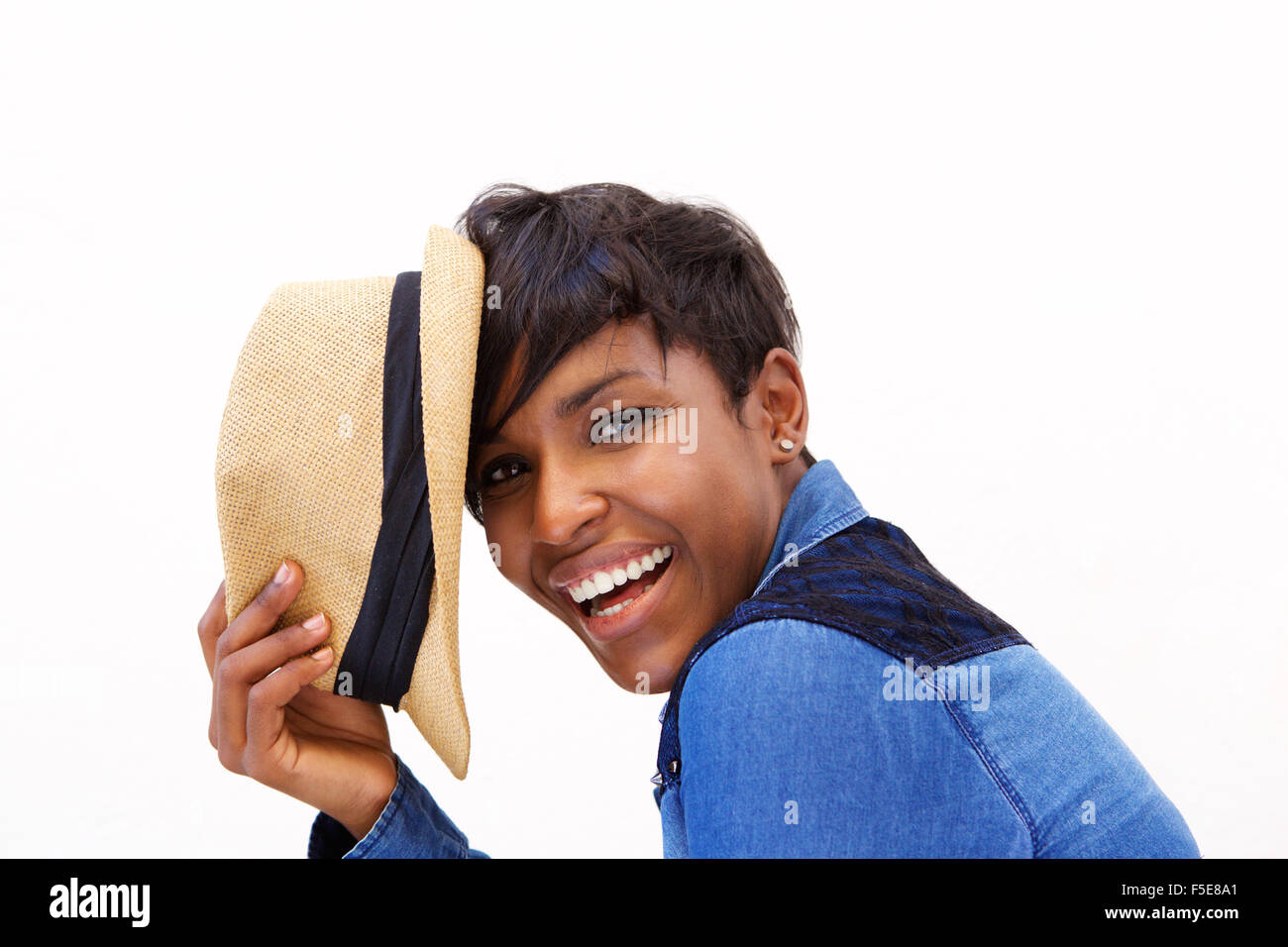 Close up portrait of an african american fashion model smiling with hat Stock Photo