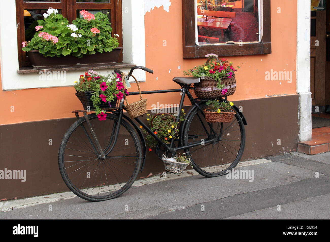Bicycle used as a flower stand Stock Photo