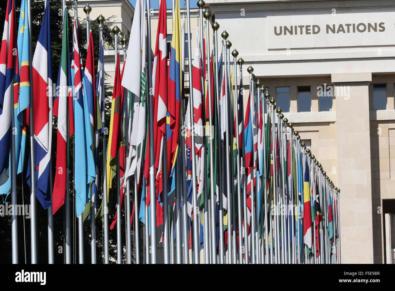 The flag lined approach to the entrance to the United Nations' Headquarters in Geneva, Switzerland, Europe Stock Photo