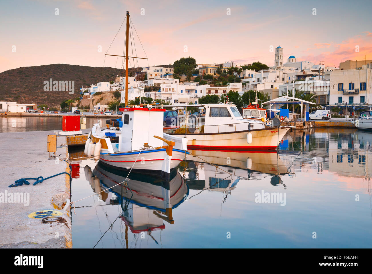 Adamantas harbour and seafront on an early morning Stock Photo