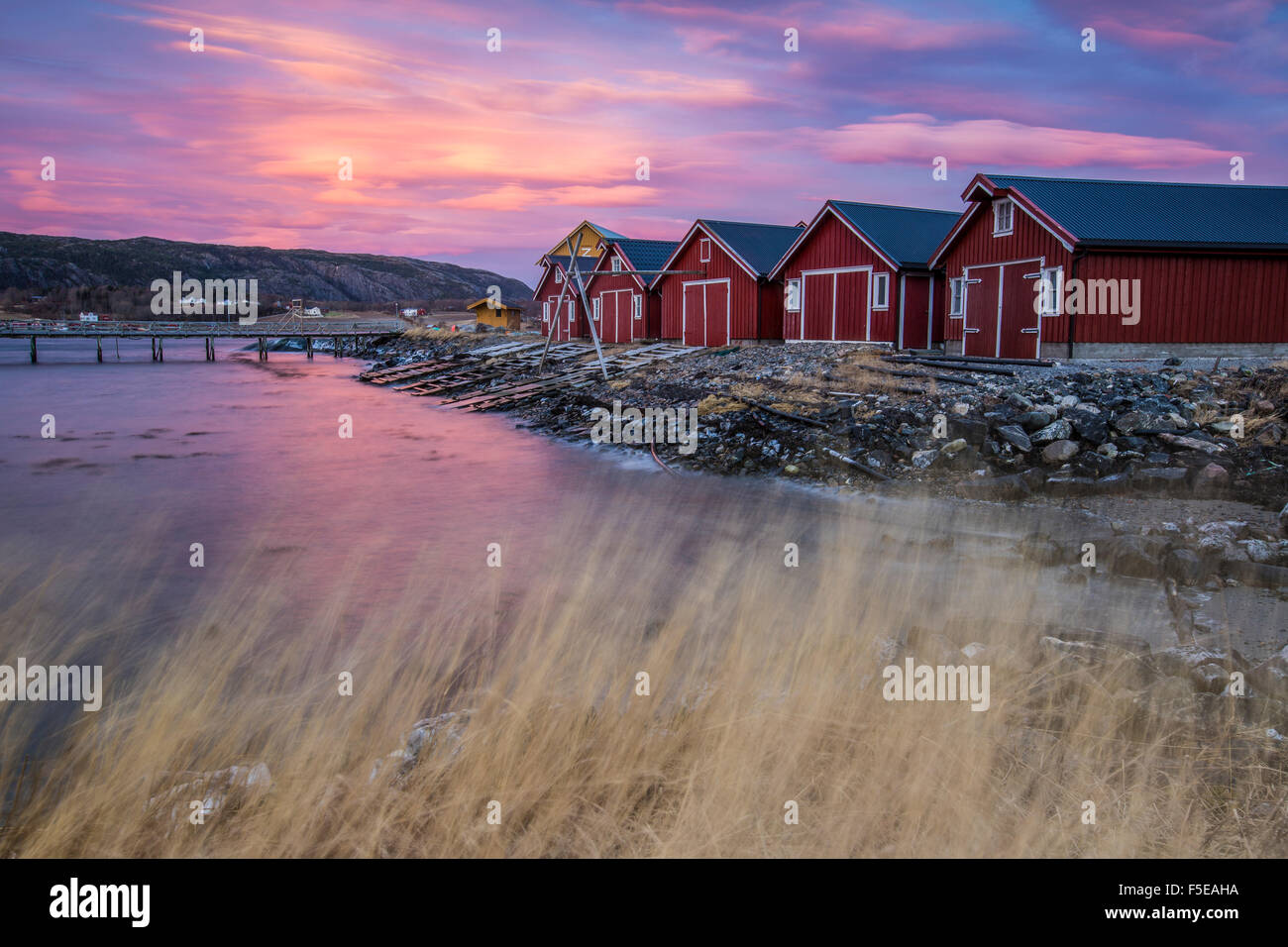 The colors of dawn light up the houses of fishermen, Flatanger, Trondelag, Norway, Scandinavia, Europe Stock Photo