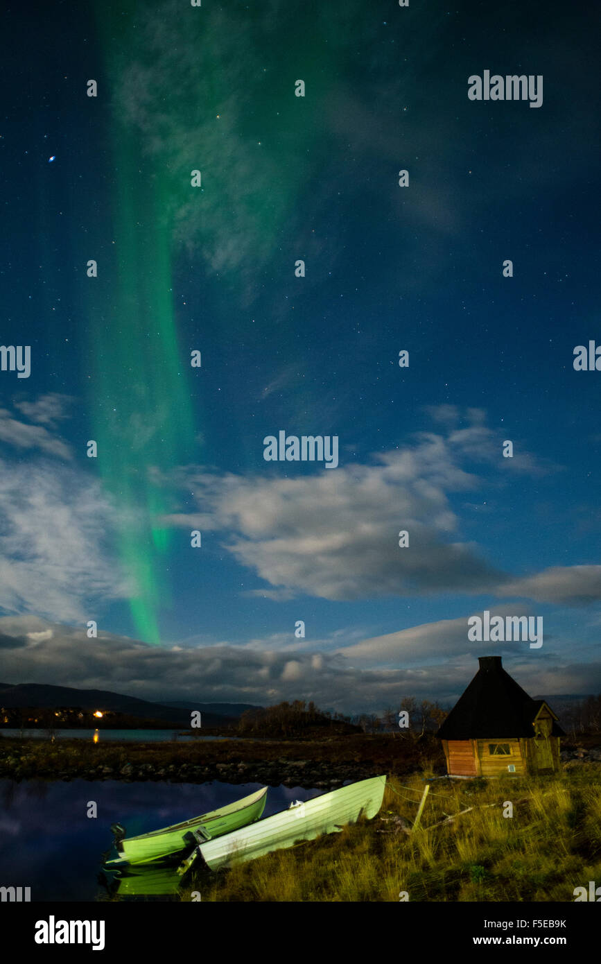 Aurora borealis over lake with boats and Kota, Kilpisjarvi, Northwest Finland, Lapland, Finland, Scandinavia, Europe Stock Photo