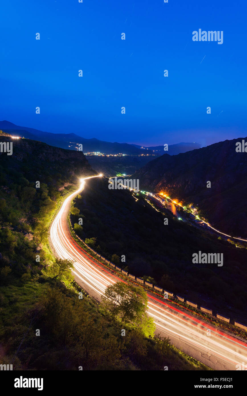Car lights on mountain road, Lori Province, Armenia, Caucasus, Central Asia, Asia Stock Photo