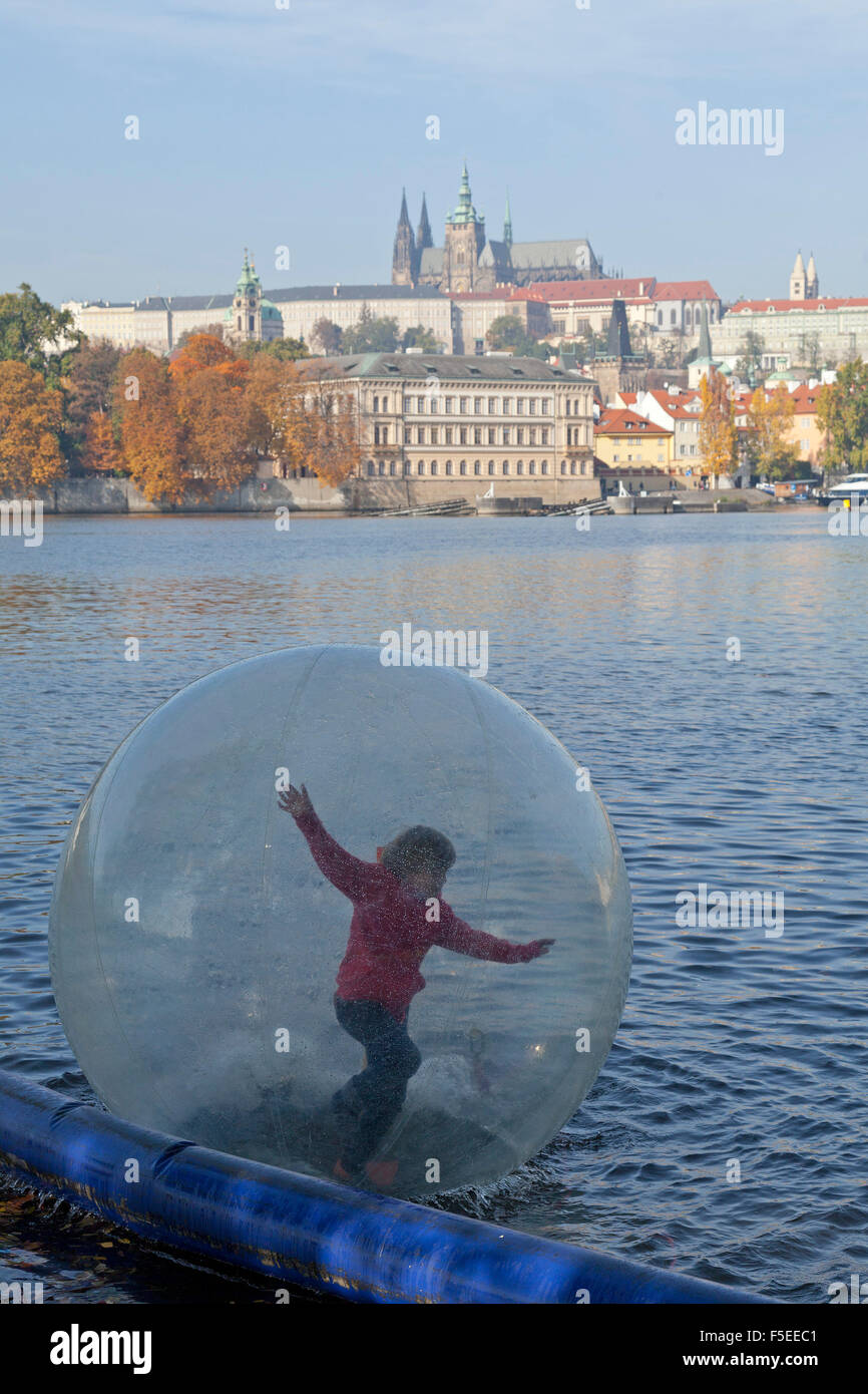 boy in water ball, castle, River Vltava, Prague, Czech Republic Stock Photo