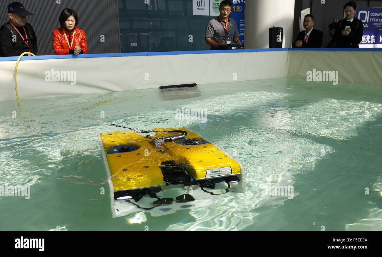 Shanghai, China. 3rd Nov, 2015. People watch an underwater robot ...