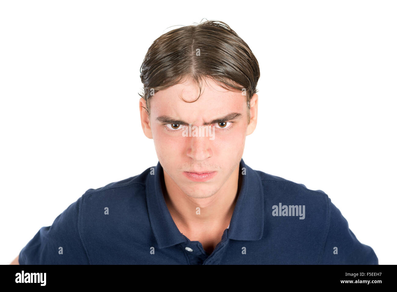 Angry geek teenage boy isolated in white Stock Photo