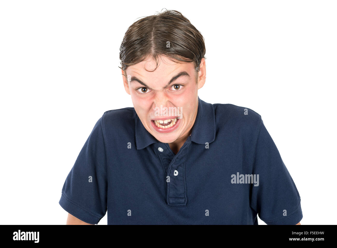 Angry geek teenage boy isolated in white Stock Photo