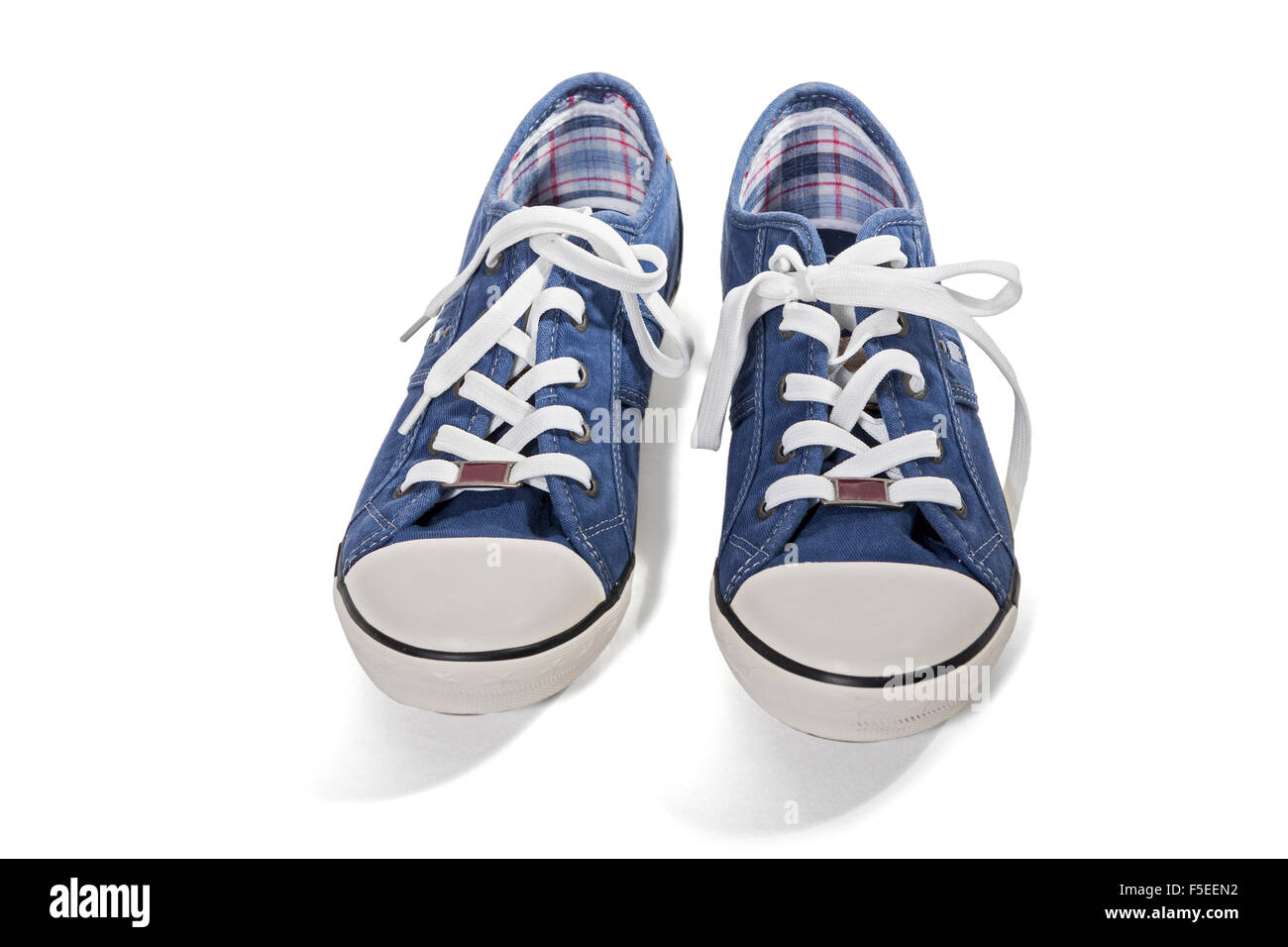 Pair of blue canvas sneakers isolated on white background Stock Photo