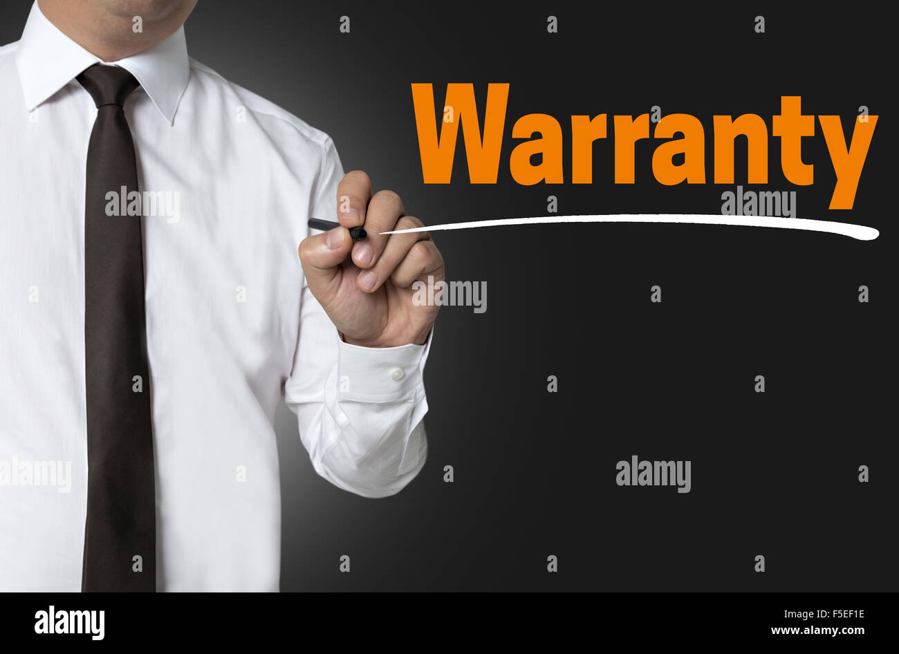 Warranty is written by businessman background concept. Stock Photo