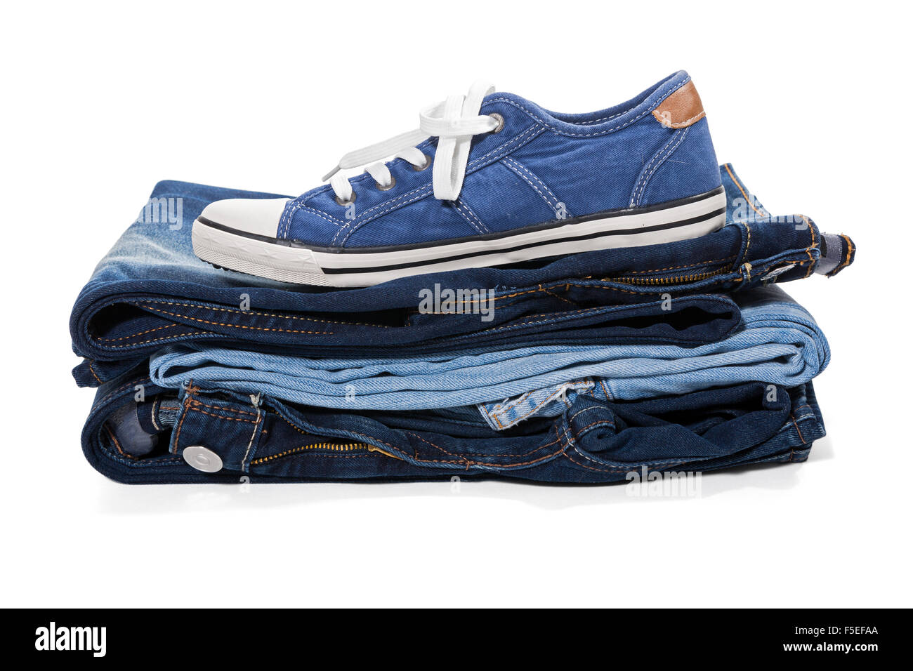 Jeans and blue sneakers isolated on white background Stock Photo