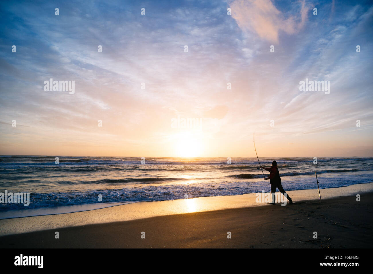 Silhouette man fishing on beach hi-res stock photography and images - Alamy