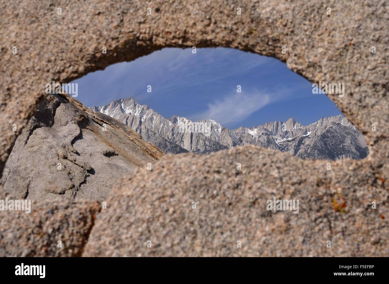 Mount whitney seen through a natural arch, California, United States Stock Photo